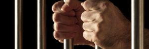 Holding onto prison bars