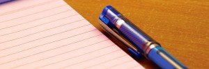 Notepad with blue pen