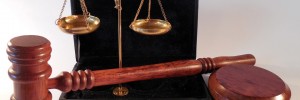 Gavel, scale, and coaster