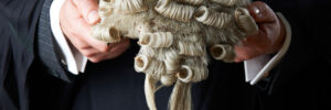 Barrister holding wig